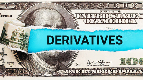 Derivatives. The word Derivatives in the background of the US dollar. Derivatives Market Analysis with Financial Charts. Risk Management, Hedging, and Investment Strategies Concept in Finance.