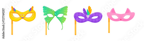 Set of carnival masks on a stick of owl, cat, feathers and butterfly, for masquerade, purim and mardi gras. On a white insulated background