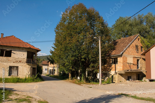 Derelict houses on the edge of Kulen Vakuf Village in the Una National Park. Una-Sana Canton, Federation of Bosnia and Herzegovina. Early September