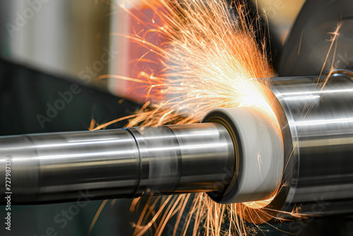 Sparks from the grinding wheel during internal grinding on a cylindrical grinding machine.