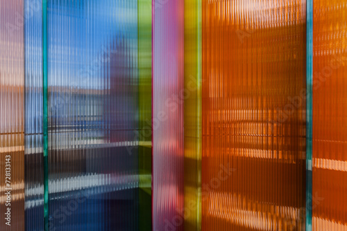 Semi-transparent colored panels with wavy surface. Decoration design elements exhibited during the Milan design week