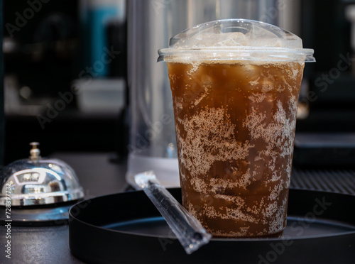 Plastic mug with cola soft drink