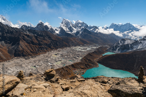 View of Village and Lake Gokyo, snow capped Cholatse, Taboche, Cholatse, Lhotse, Nuptse, Everest, Pumori of the Himalayas and Ngozumpa Glacier. View from Gokyo Ri, Solukhumbu, Sagarmatha, Nepal.
