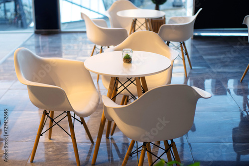 White wooden tables and chairs, kitchen furniture, modern cafe interior