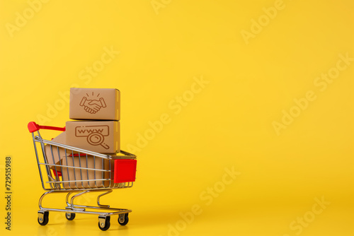 For products with cardboard boxes in it on a yellow background the concept of discounts and promotions online shopping