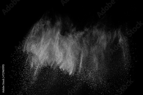 Abstract white dust on black background. Light smoke texture. Powder explosion. Splash water overlay. 