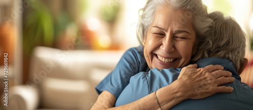 Portrait happy woman nurse hug her old senior patient in elderly care house. AI generated image