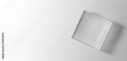 白背景に透明な立方体のガラスの台座。コピースペース。俯瞰。3D（横長）