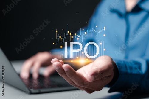 IPO, Initial public offering concept. Businessman use laptop with virtual IPO word with stock graph for boosting the growth by IPO process.