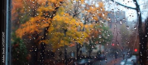 Fall rain, raindrops on glass, tape on windows.