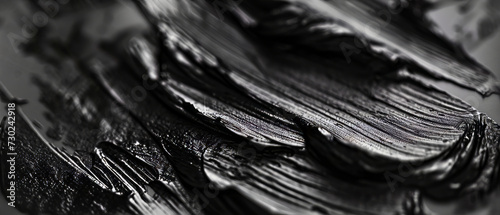 Close-up of textured black brush strokes on a surface