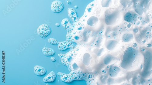 splash of foam from soap or shampoo on blue background