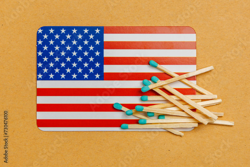 Matches on an American flag background with selective focus and copy space
