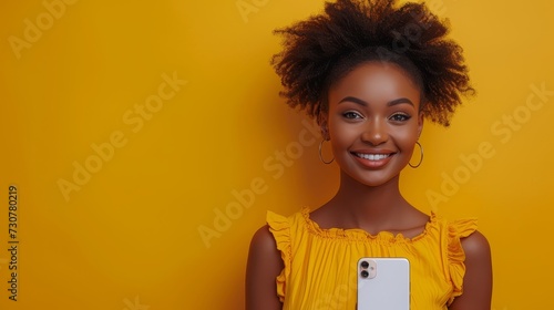 Positive African American pretty lady showing her modern cell phone on a yellow studio background, recommending a mobile app, collage.