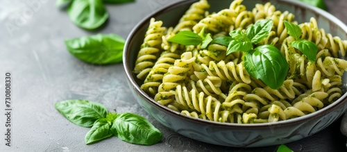 Italian cuisine's traditional dish is a bowl of fusilli pasta with pesto sauce.