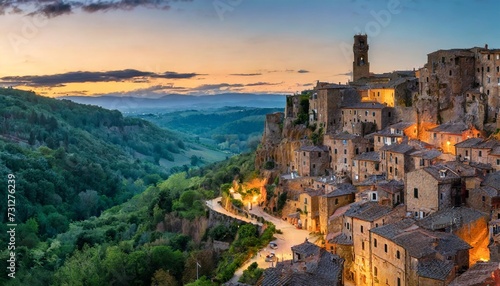 panoramic of sorano in the evening sunset with old tradition buildings and illumination tuscany italy