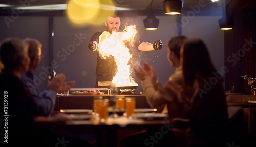 In a restaurant setting, a professional chef presents a sizzling steak cooked over an open flame, while an European Muslim family eagerly awaits their iftar meal during the holy month of Ramadan