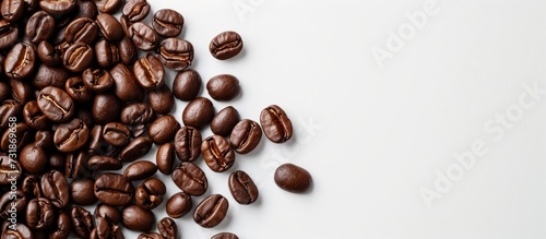 A stack of coffee beans, with origins ranging from Jamaican Blue Mountain to Kona, sits on a white surface.