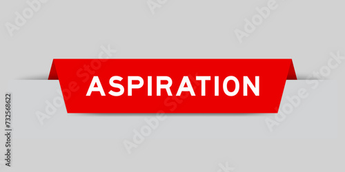 Red color inserted label with word aspriation on gray background