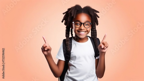 An African-American elementary school girl with a backpack, showing a thumbs-up on peach fuzz. A happy student girl celebrates freedom by recommending the best education choice.
