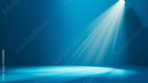 A spotlight with a cool blue hue highlighting a circular area.