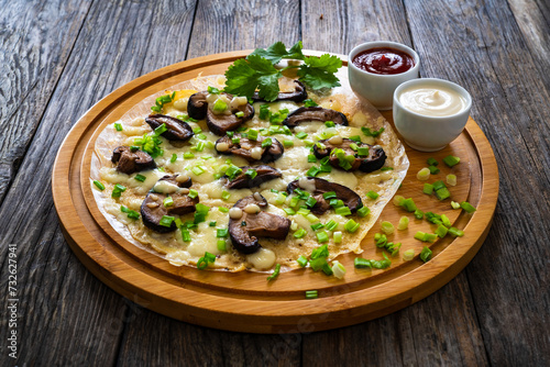 Vietnamese pizza - rice pepper omelet on wooden table