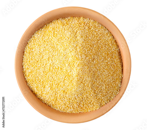 Corn polenta in clay pot, uncooked isolated on white, top view 