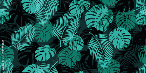 Modern seamless pattern with trendy tropical palm and monstera leaves. Suitable for backgrounds, wallpapers, textiles, prints, and much more.