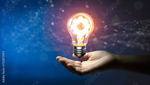 Hand holding Creative light bulb with cog inside and technology background. Innovation business idea knowledge, Planing strategy, and Analysis solution development Concept. Generative AI.