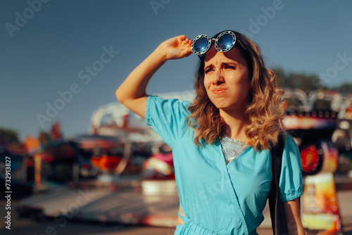 Funny Woman Removing her sunglasses to see in the Distance. Lady squinting trying to spy on someone from afar 