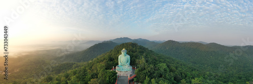 Aerial view of The Great Buddha at Doi Phra Chan is a towering bronze Buddha statue that can be reached by climbing 628 steps up at wat Prathat Doi Prachan, Pa Tan, Mae Tha District, Lampang, Thailand