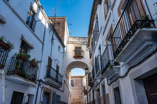 Picturesque streets with grilled balconies and white facades in Caceres, Extremadura.