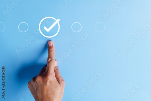 approval, approved, check, checkmark, choice, choose, confirm, correct, cross, decision. pointing at correct marks in round via finger on blue background color, the concept of choice without people.