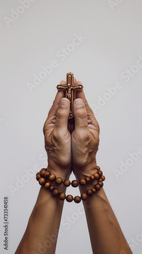 Soulful prayer: a man in quiet devotion, hands clasped around a rosary cross, seeking solace and spiritual connection, capturing the essence of serene contemplation, faith, and religious devotion.