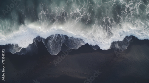 Top view of black sand and sea