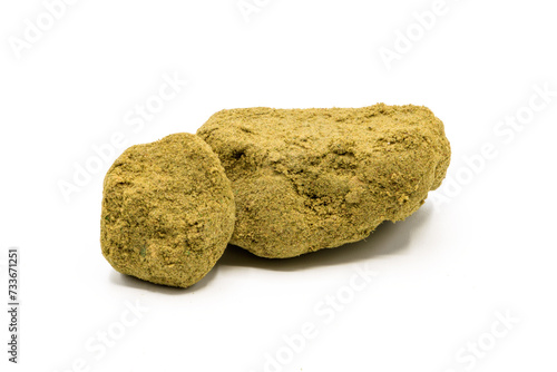 Closeup of piece of hashish pollen isolated on white background