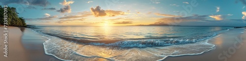 Tropical island sunrise panorama, with the first light touching the sandy shores