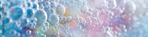 Macro photo of bubbles in water. Background with foam made of soap, shampoo, lotion, detergent. Colorful banner with copy space for laundry and cleaning services, spa, beauty, skin care concept.