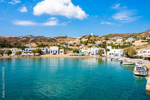 View of Kimolos port with white houses and sea bay, Kimolos island, Cyclades, Greece