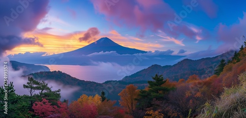 Dawn breaks over Mount Fuji and colorful autumn foliage, painting the landscape in breathtaking hues.