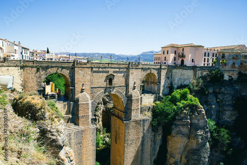 Ronda, Spain. Aerial evening view of New Bridge over Guadalevin River in Ronda, Andalusia, Spain. View of the touristic city.