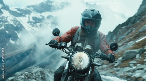 Biker exploring snowy mountain roads with adventure motorcycle