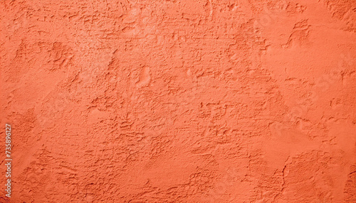 Grunge coral color stucco Background. Abstract orange backdrop. Decorative artistic Wall room Close up. Rough Surface plaster Texture With Copy Space for Design
