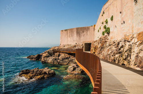 Bastia harbor old town panoramic view from promenade Aldilonda, which means “Above the Sea” in Corsican on bright sunny morning, Corsica island, France.