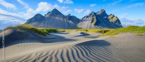 Sand dunes on the Stokksnes on southeastern Icelandic coast with Vestrahorn (Batman Mountain). Iceland, Europe