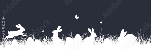Easter background. Easter banner with grass and bunny. Easter bunny or rabbit with eggs and butterfly on the grass