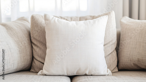 A perfectly styled plain pillow rests on a luxurious, cozy couch, showcasing its exquisite fabric and impeccable form. This mockup is ideal for showcasing home decor designs and creating a w