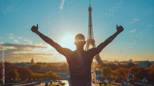 African athlete representing athletics with arms wide open at the Paris Olympics games, with the Eiffel Tower in the background