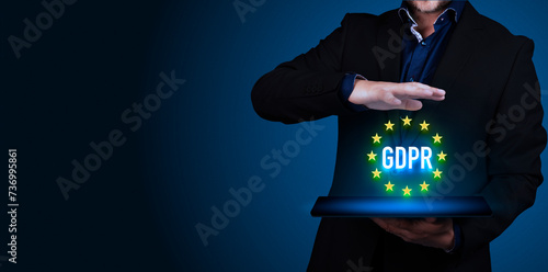 General Data Protection Regulation, GDPR, European Data Privacy Act. Businessman holds a tablet computer with GDPR test. Copy space.