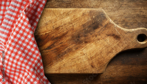 Old wooden cutting board with a red and white checkered tablecloth on a wooden table with copy space. Template for recipes or food and drink menu. Generative Ai.